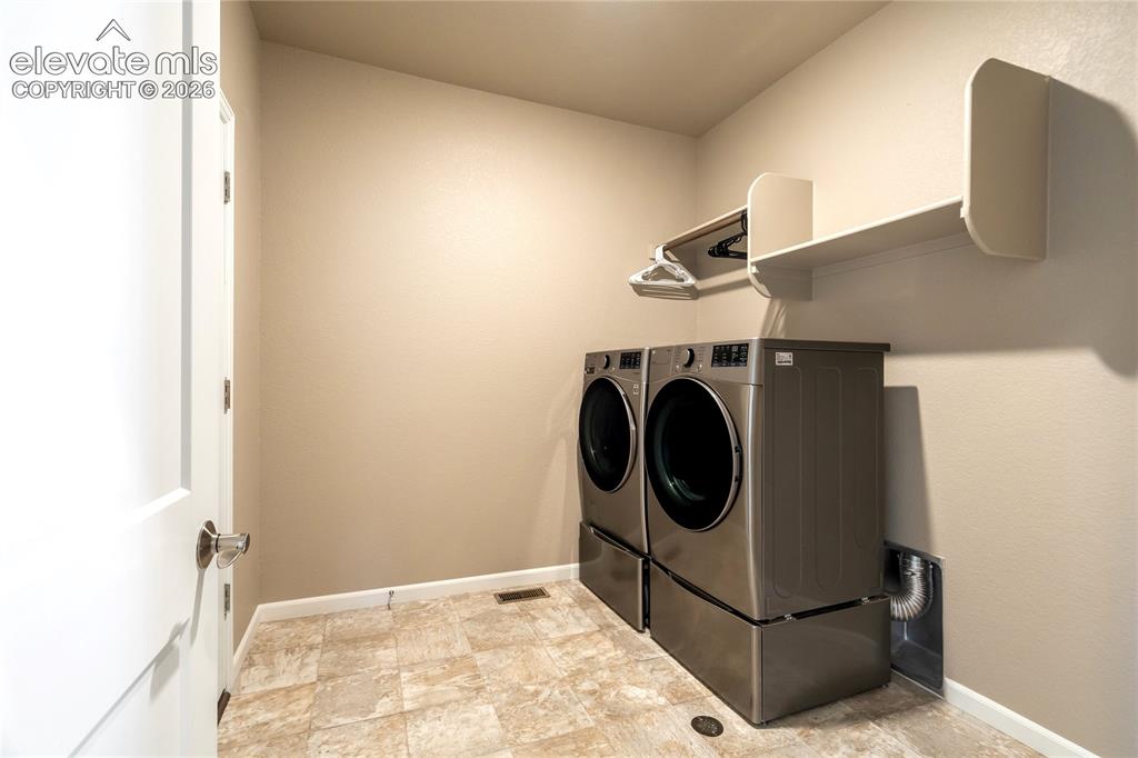 Image 32 of 48: Laundry Room
A dedicated main-level laundry room adds convenience and func