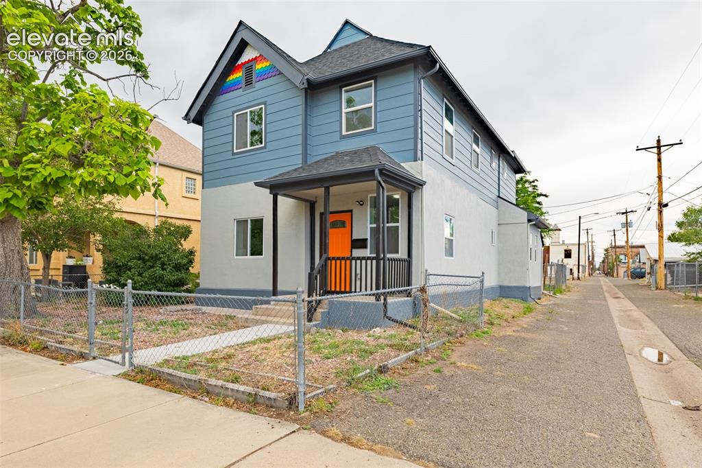 Image 1 of 50: Two-story exterior featuring blue siding and a light gray stucco finish