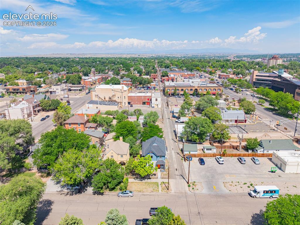 Image 43 of 50: Aerial perspective showcasing a vibrant urban landscape with a mix of comme