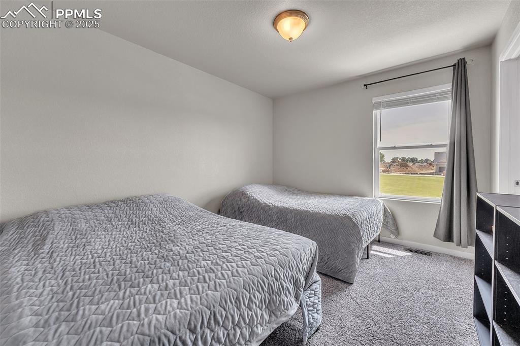 Image 27 of 50: Bedroom featuring carpet flooring and baseboards