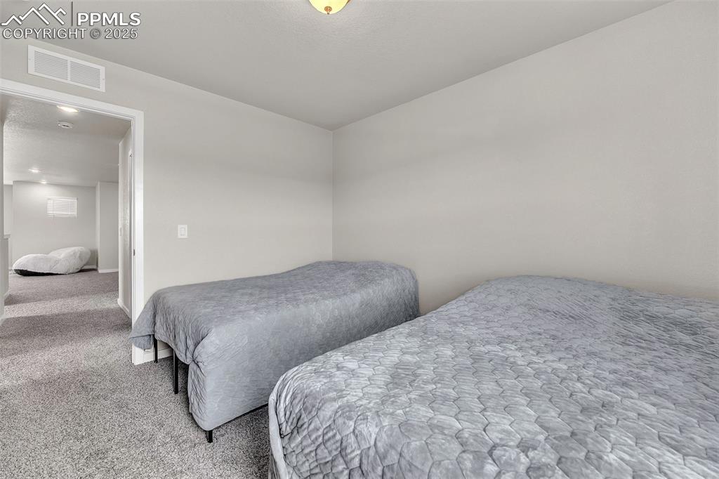 Image 28 of 50: Bedroom with carpet