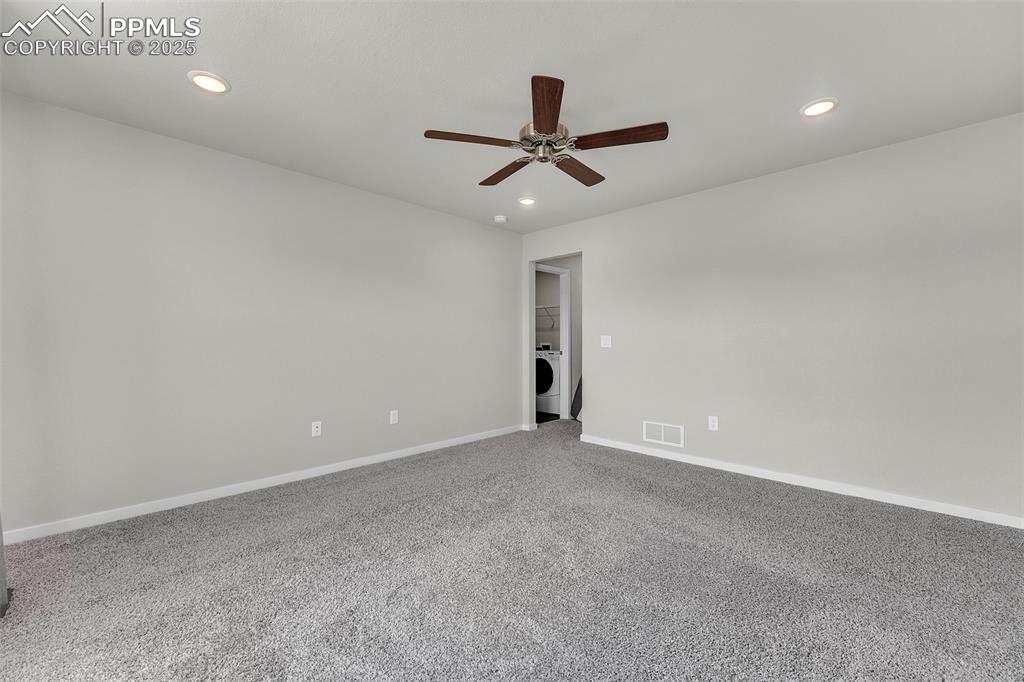 Image 36 of 50: Empty room featuring recessed lighting, light carpet, ceiling fan, and wash