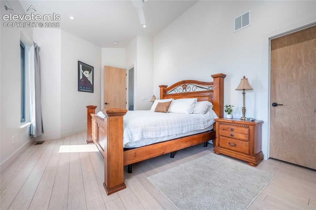 Image 15 of 49: Main Floor Primary with walk in closet & en suite bathroom