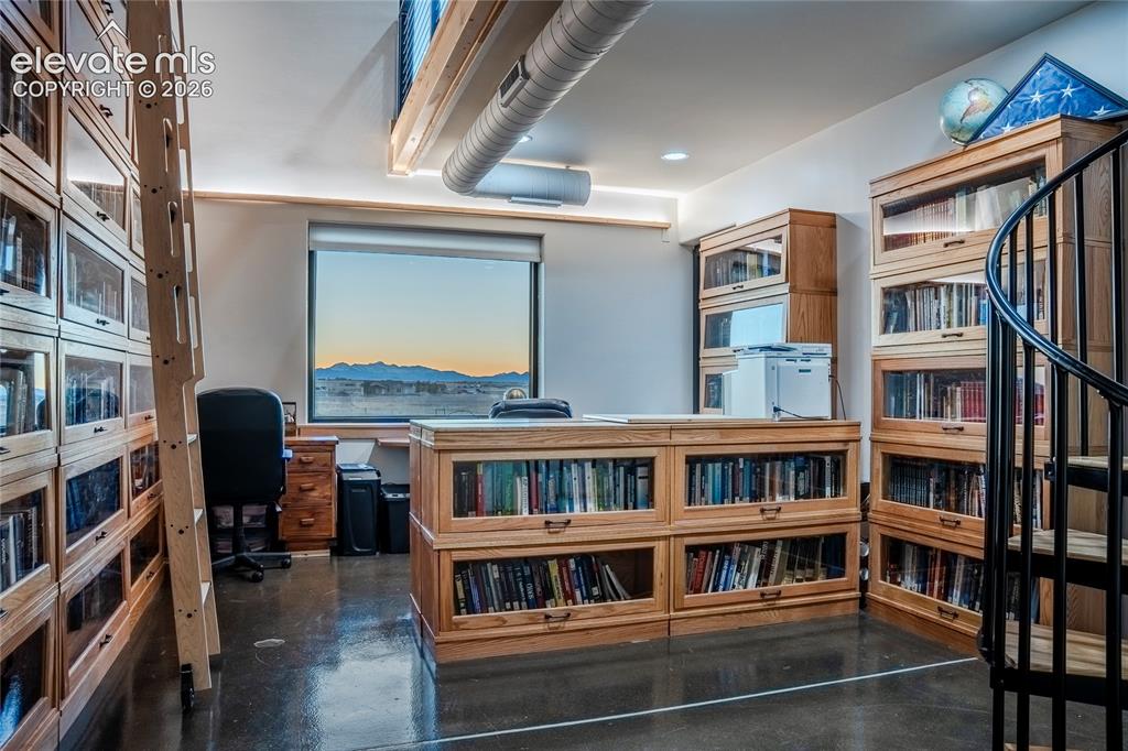 Image 35 of 49: Large office or bonus space with upstairs loft- Mountain Views!