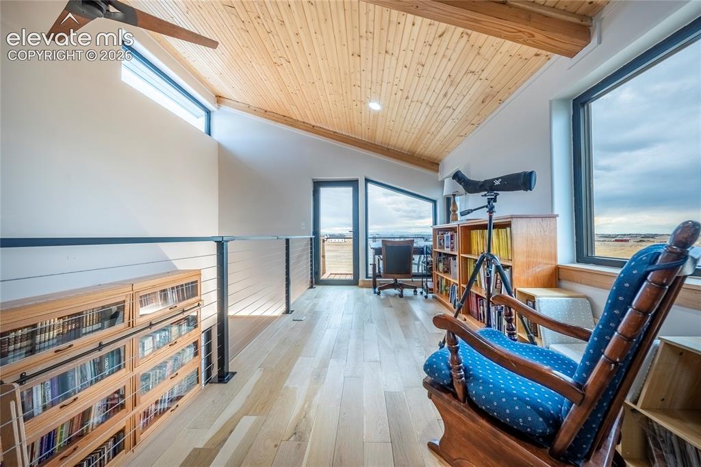Image 36 of 49: Upstairs loft with Balcony/Patio and mountain views!