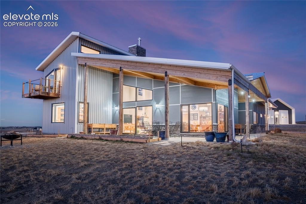 Image 41 of 49: Large covered wrap around porch (ADU)