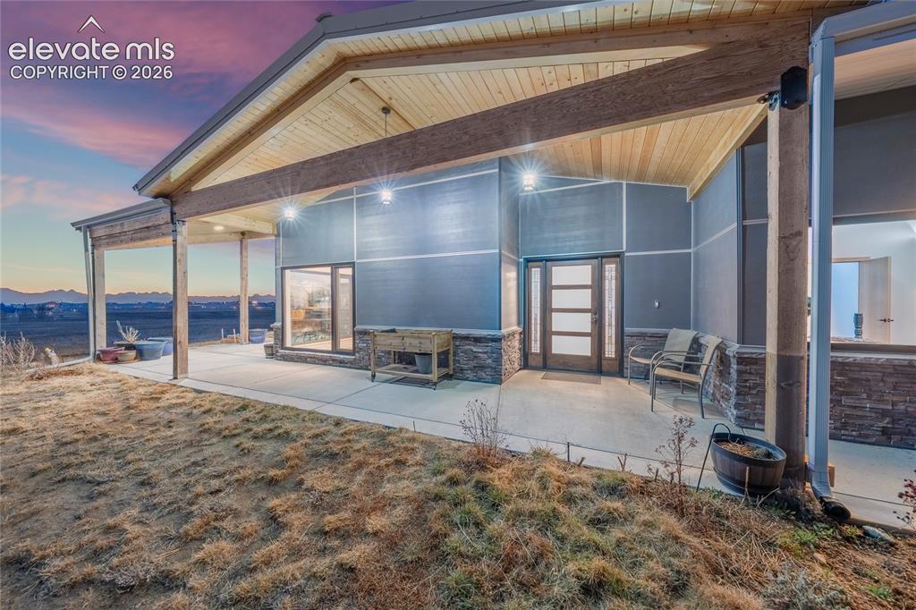 Image 42 of 49: Covered porch with Mountain views