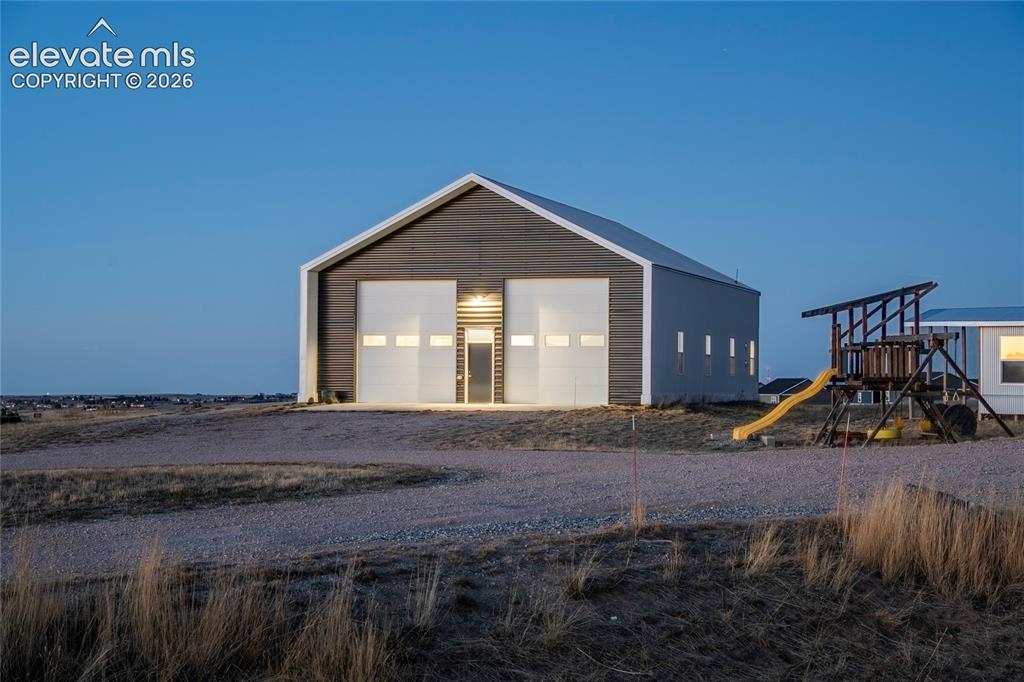 Image 43 of 49: Heated 64/40 Shop with storage loft, dedicated 200 amp panel, Full RV Hooku