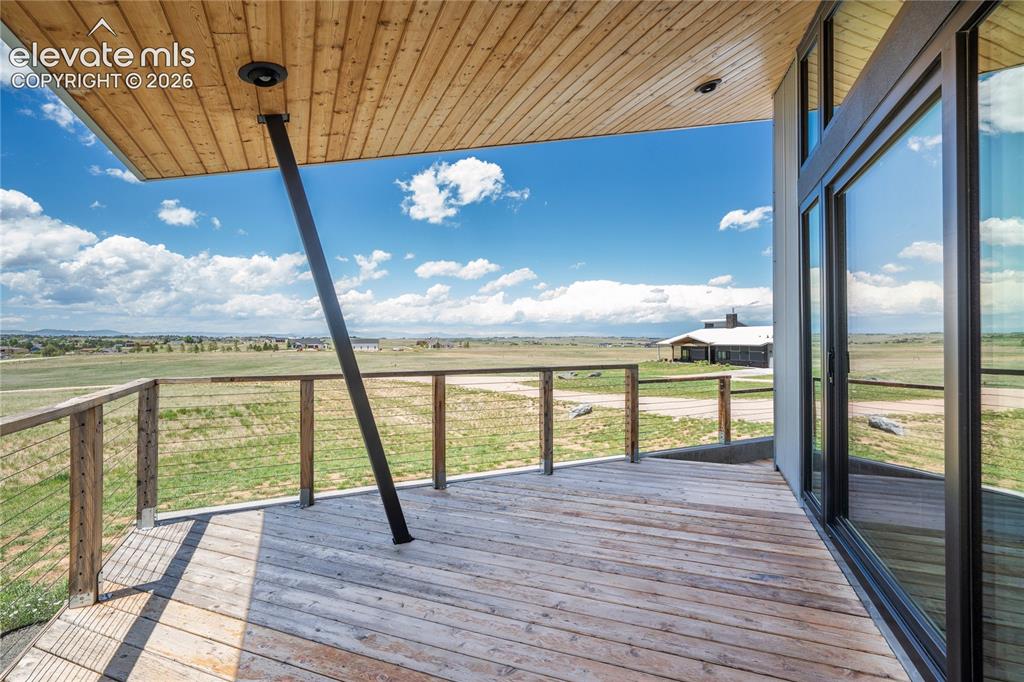 Image 6 of 49: Covered Deck with mountain views (Primary Home)