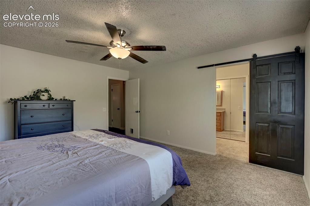 Image 29 of 49: Recessed lighting, ceiling fan, carpet flooring, flat panel interior door, 