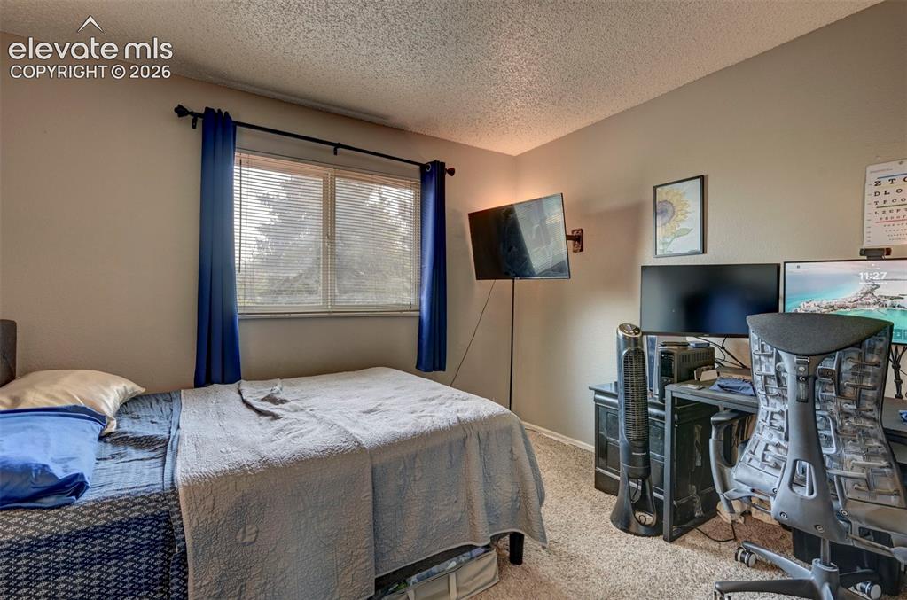 Image 35 of 49: Double-paned window with horizontal blinds