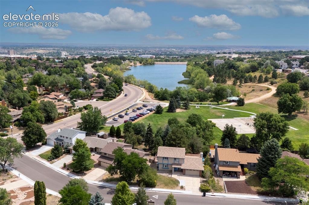 Image 6 of 49: Aerial perspective showcasing a residential area, a prominent body of water