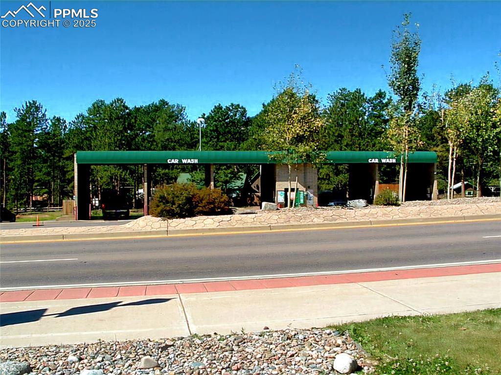 Image 4 of 6: View of asphalt street featuring curbs