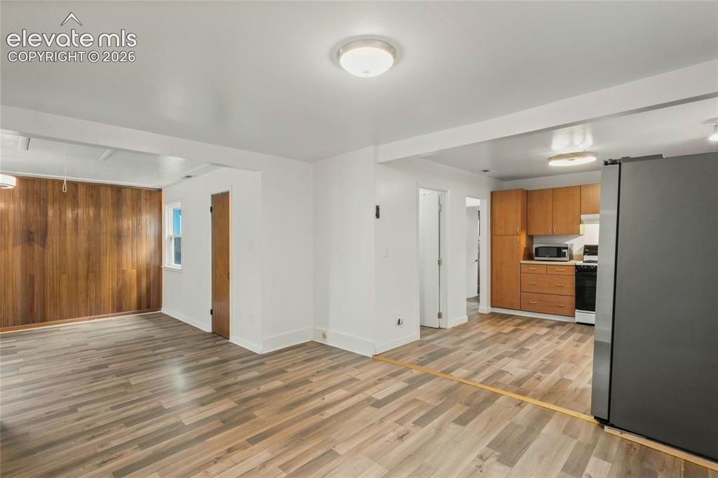 Image 15 of 41: Dining Area looking into the Kitchen and Living Room, very open of entertai