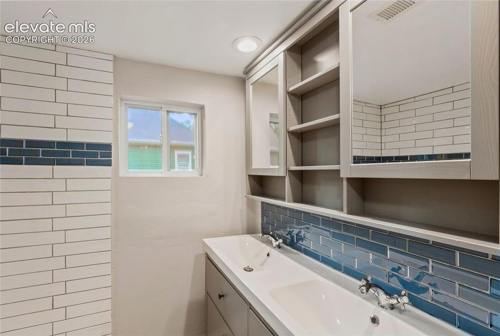 Image 30 of 41: The bathroom has enough space for a double vanity