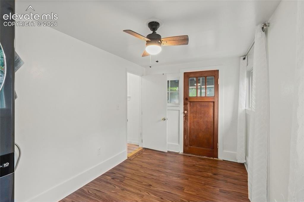 Image 33 of 41: The laundry room walks out to the back yard and access to the crawl space