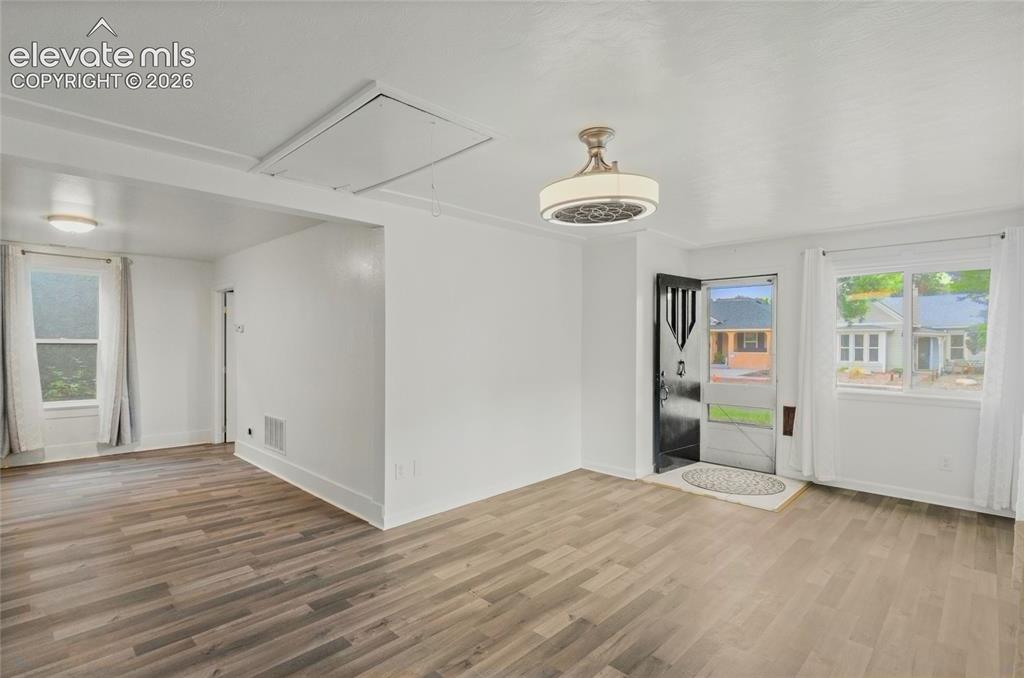 Image 7 of 41: Entry and Living Room, lots of light