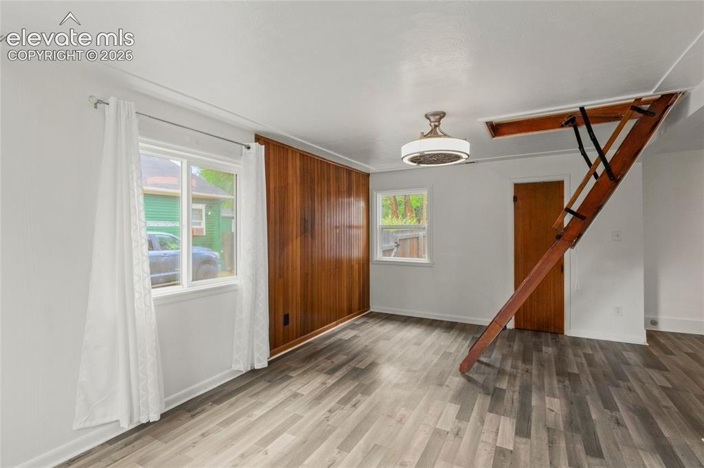 Image 8 of 41: Living Room with loft access 