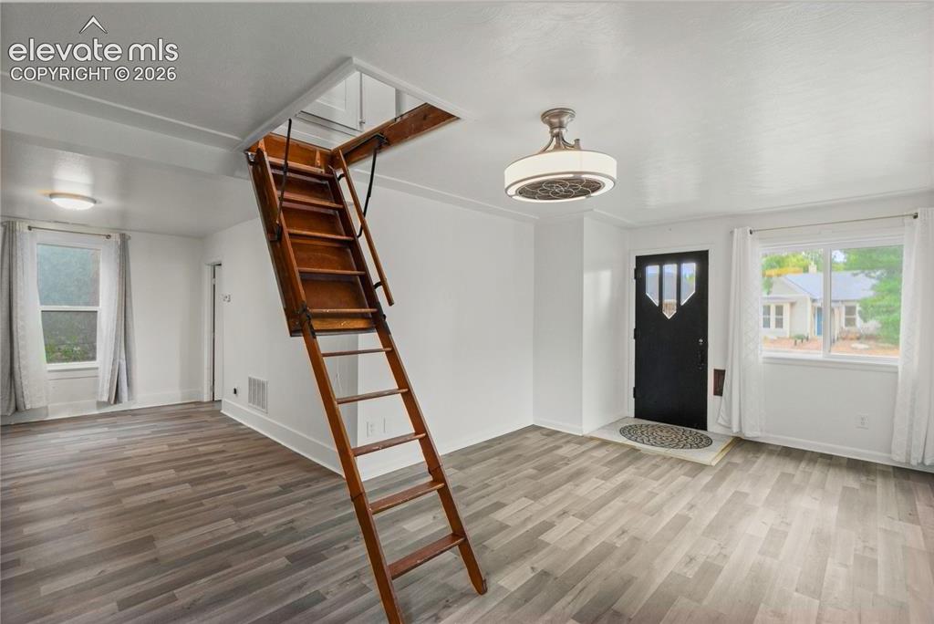 Image 9 of 41: Living Room and Entry showing loft access
