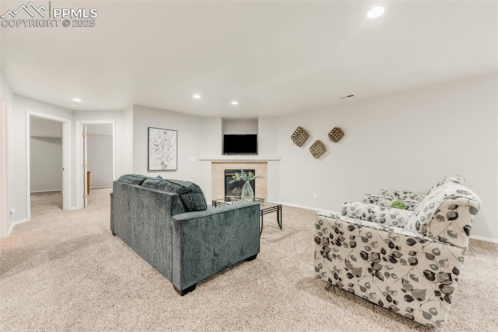 Image 33 of 47: Downstairs Family Room also has a fireplace