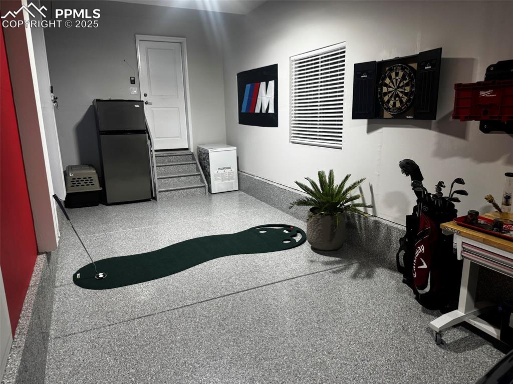 Image 48 of 50: Room for the 3rd Car or space to work on your short game!