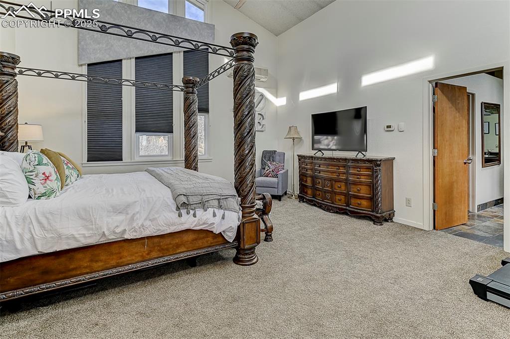 Image 29 of 42: Primary suite featuring high vaulted ceiling and tons of natural light.