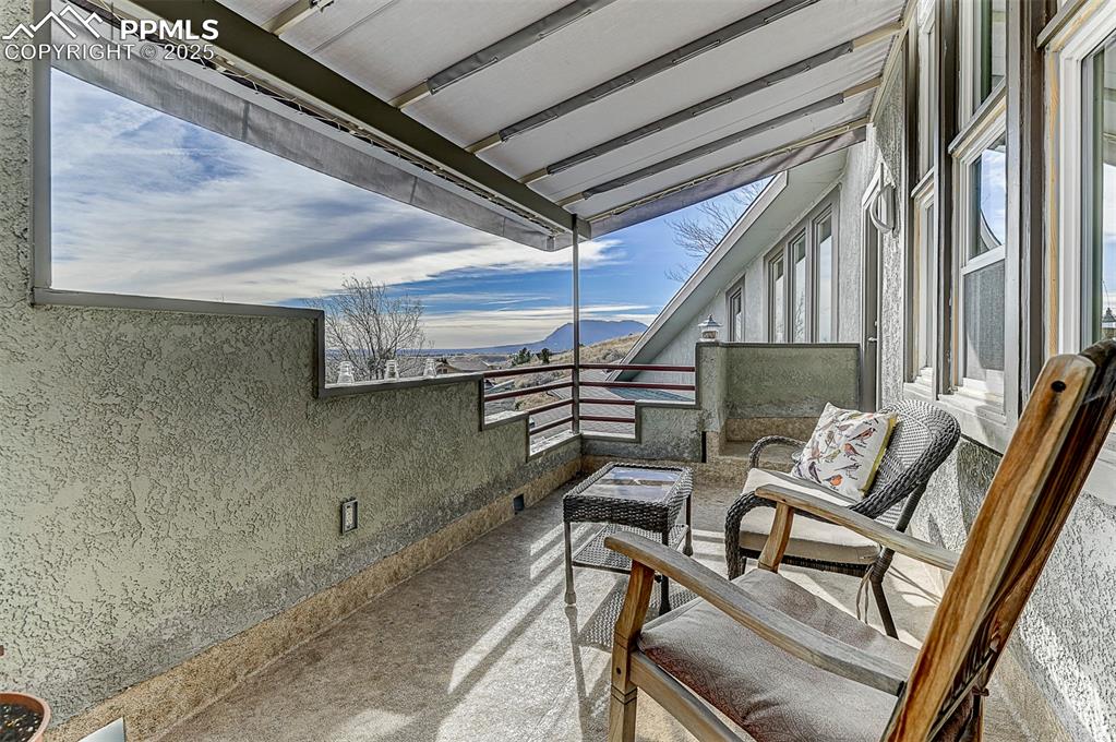 Image 37 of 42: Balcony from primary suite with a mountain and city views.