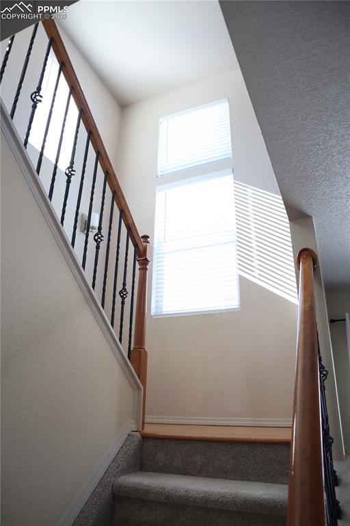 Image 12 of 34: Front Entry and Staircase.
