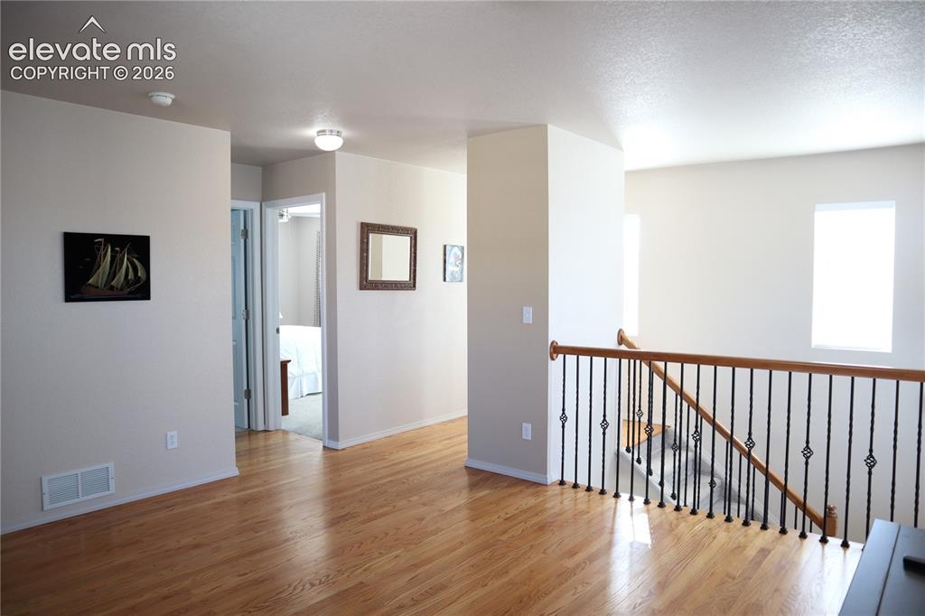 Image 15 of 34: Leading to Full Bath and Two Bedrooms.