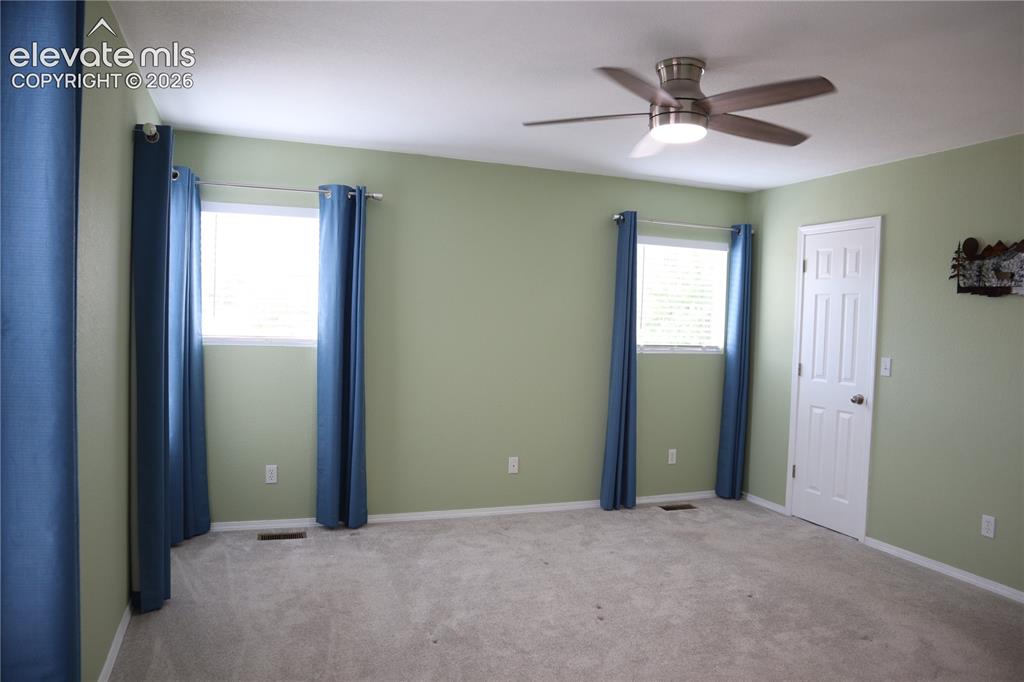 Image 21 of 34: Upstairs Main Bedroom.