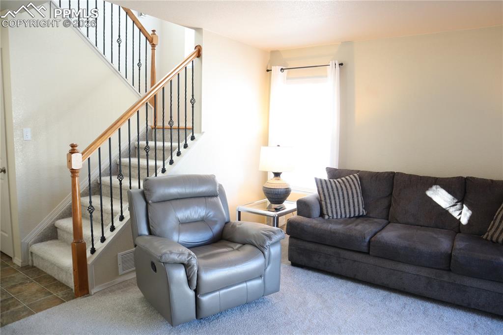 Image 3 of 34: Walk Out, Gas Fireplace and New Carpet.