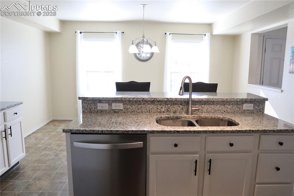 Image 9 of 34: Kitchen looking into the Living Room.