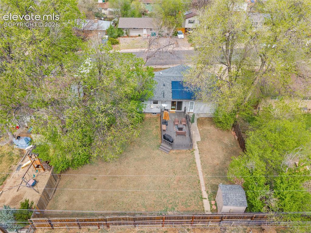 Image 42 of 49: aerial view of the backyard