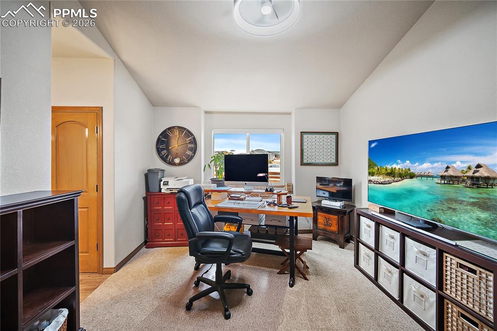 Image 21 of 49: Main level bedroom #2, currenlty being used as an office. Attatched Jack-n-