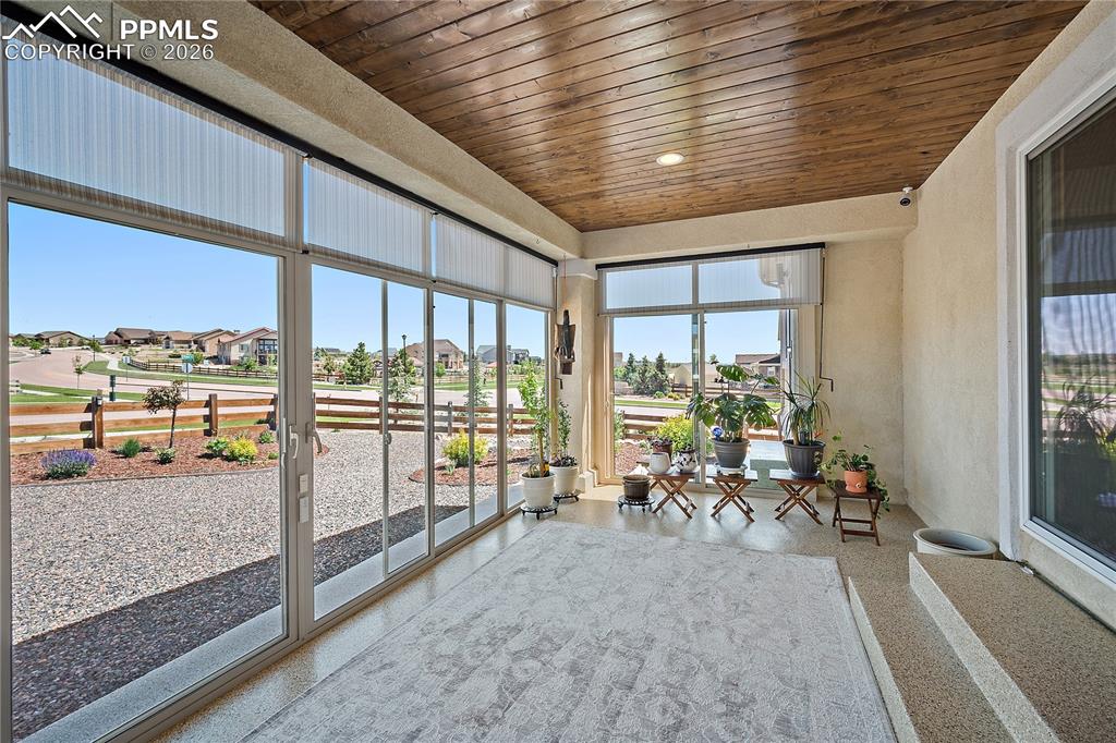 Image 36 of 49: Enclosed patio