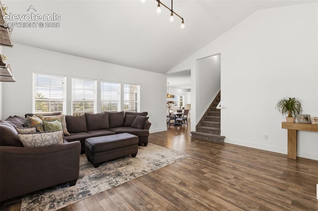 Image 10 of 41: Great room style in feel with living connected to dining and kitchen