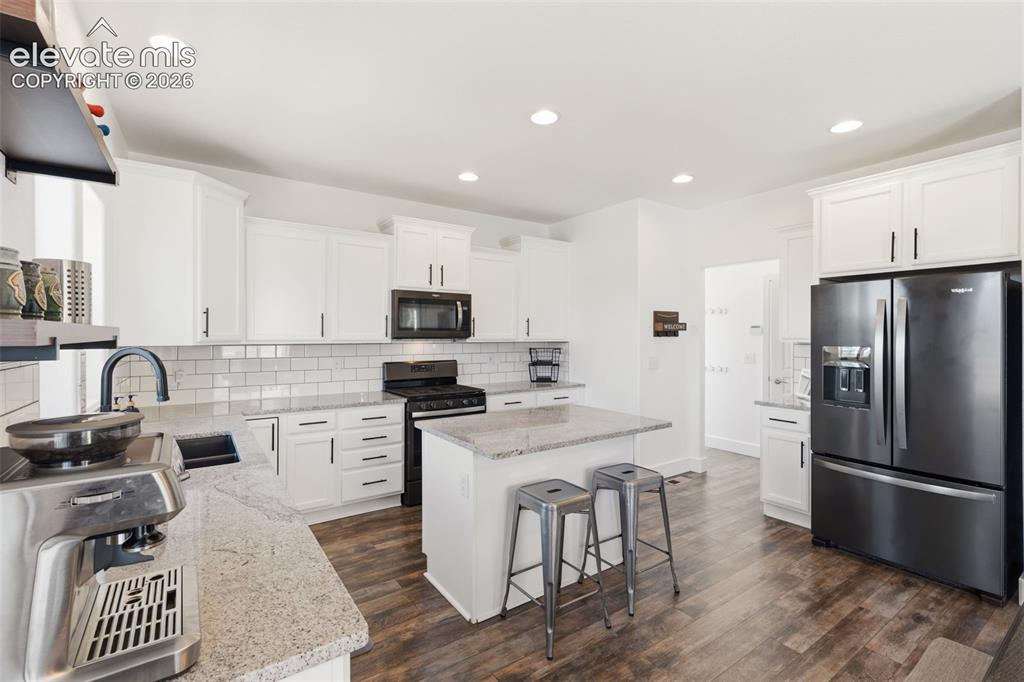 Image 17 of 41: Light bright and updated with stainless steel appliances and gas range