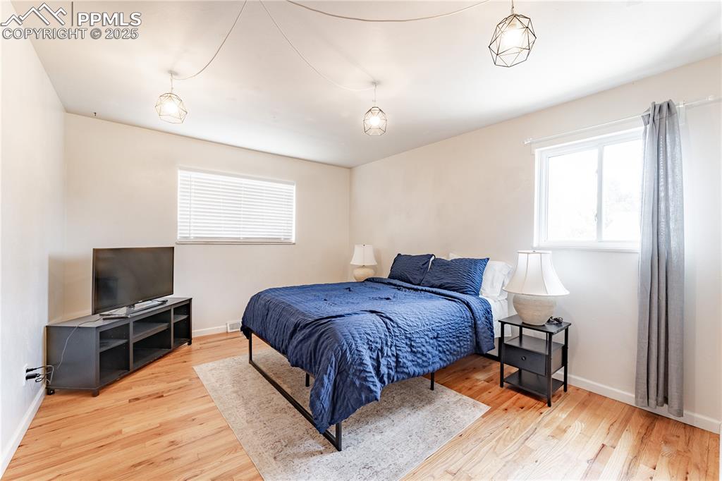 Image 15 of 39: Bedroom featuring light wood finished floors