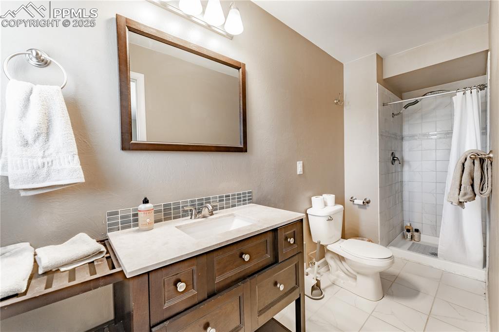 Image 22 of 39: Full bath featuring vanity and a stall shower