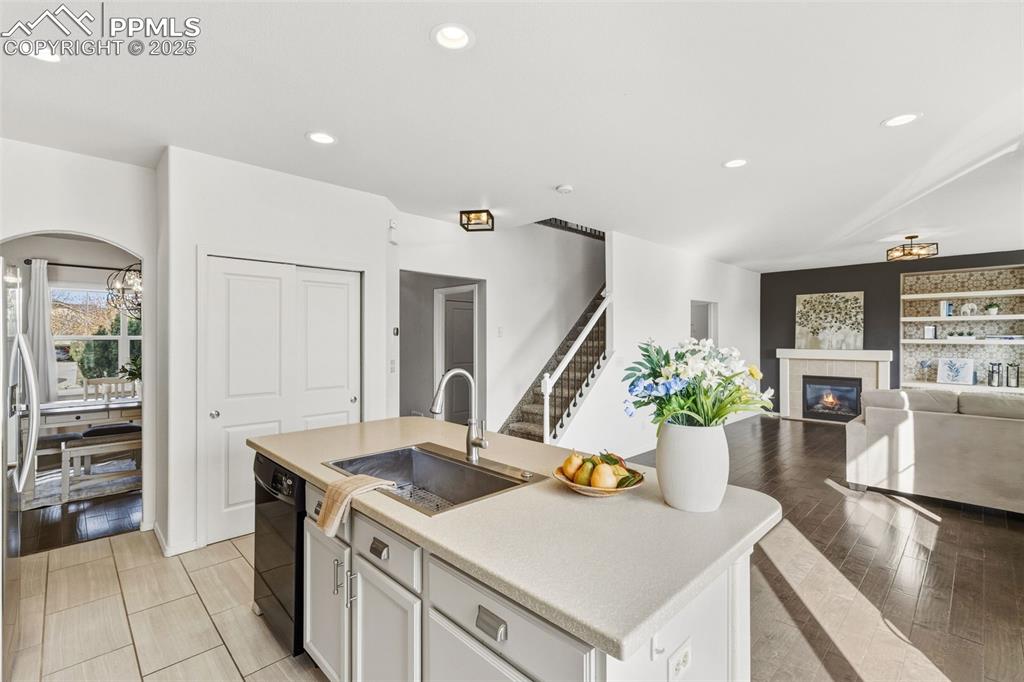 Image 15 of 41: Kitchen featuring white cabinetry, light countertops, recessed lighting, op