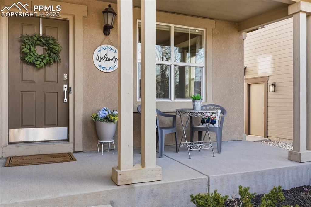 Image 9 of 41: Entrance to property featuring stucco siding