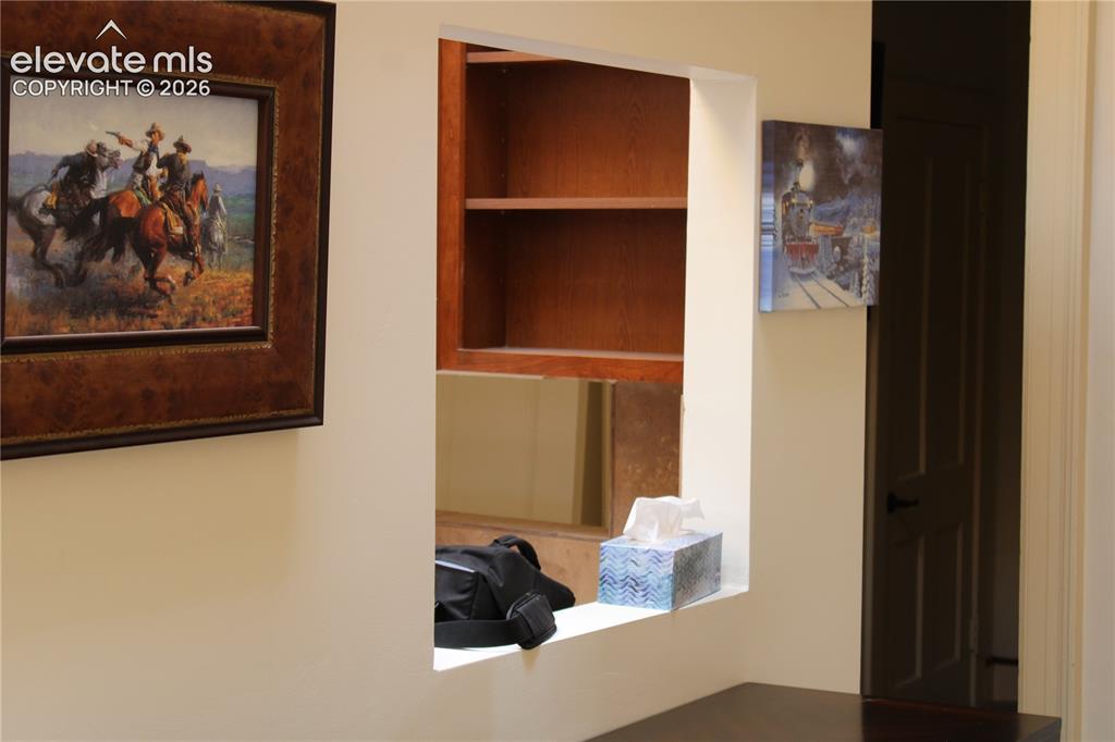 Image 8 of 11: looking into kitchen from living room upstairs apt