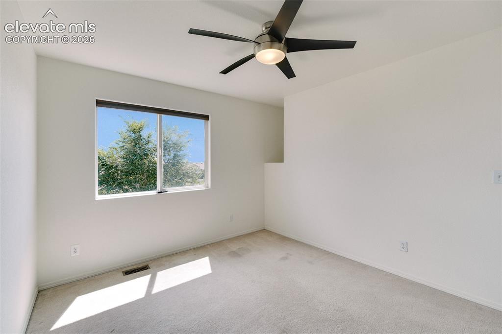 Image 26 of 47: Vaulted ceiling with an integrated ceiling fan and light fixture