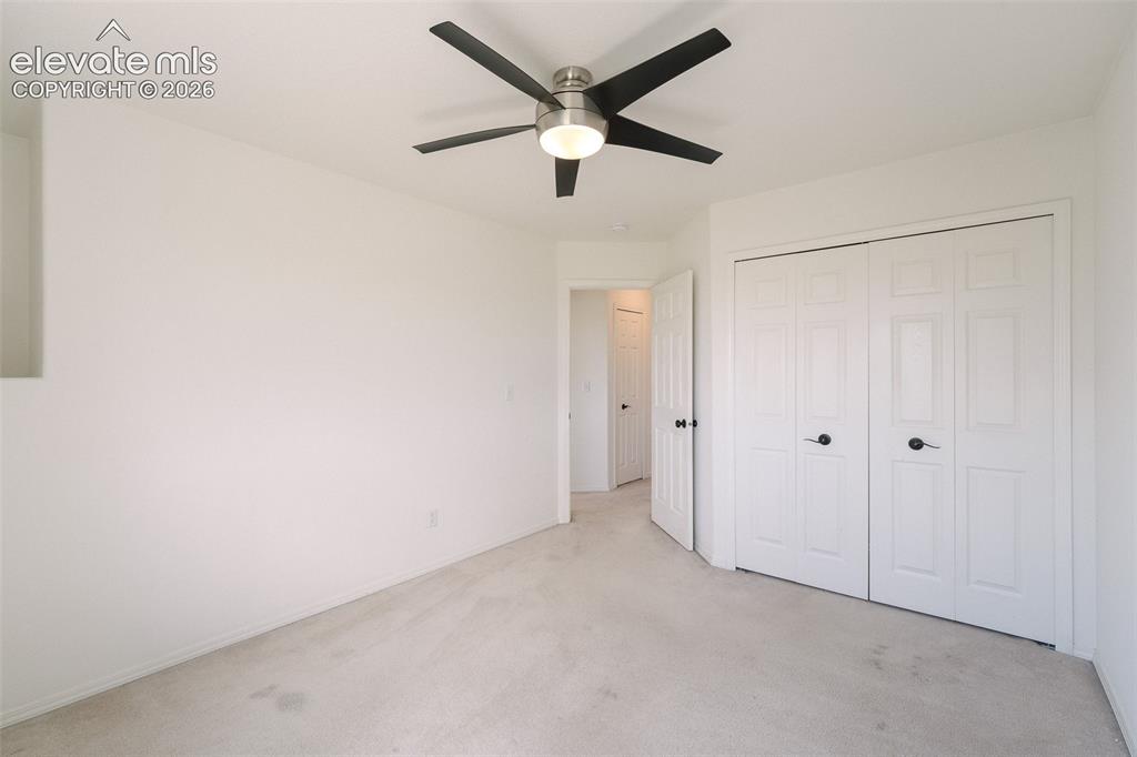 Image 27 of 47: Recessed wall detail, ceiling fan with brushed nickel finish, neutral wall