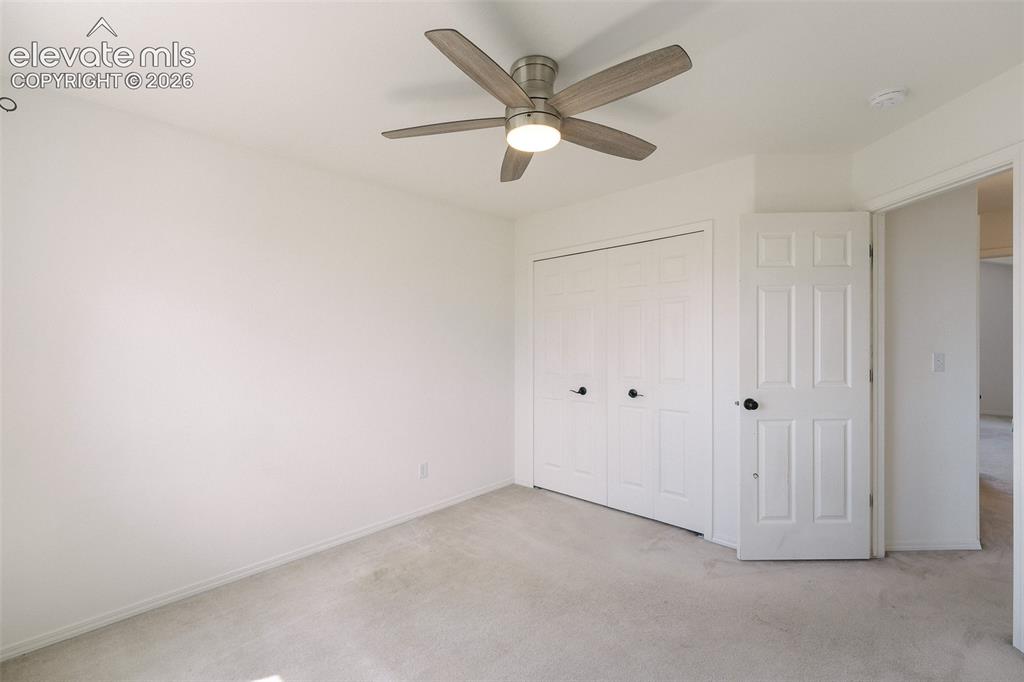 Image 31 of 47: Neutral carpeting and light-colored walls