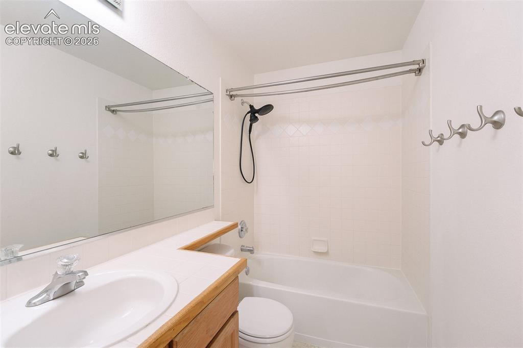 Image 33 of 47: Integrated vanity with a single basin sink and laminate countertop