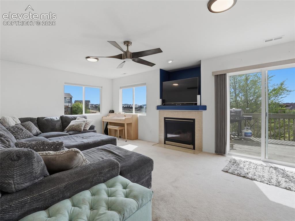 Image 35 of 47: Recessed lighting and ceiling fan overhead