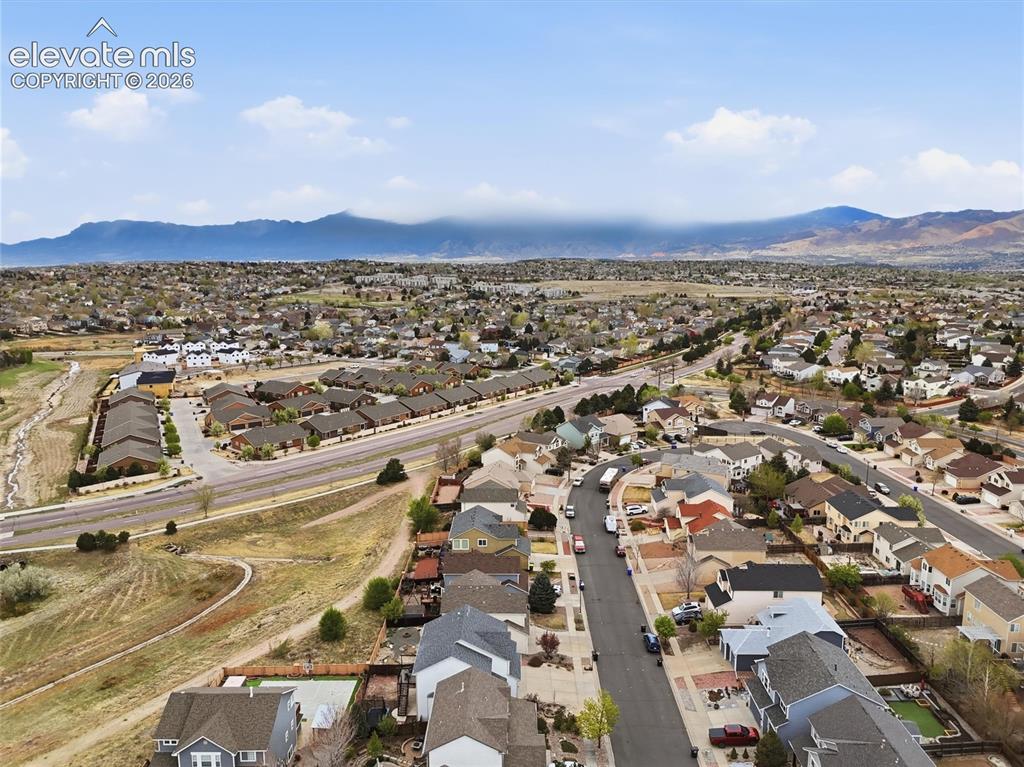 Image 46 of 47: Expansive neighborhood setting with distant mountain scenery