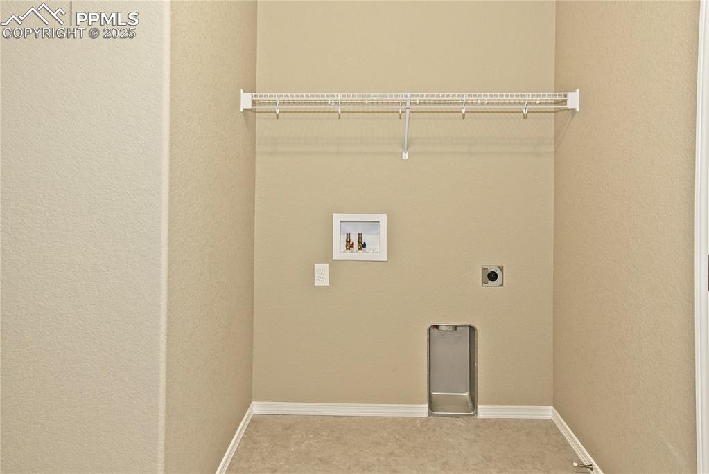 Image 17 of 25: Laundry area with electric dryer hookup, washer hookup, and carpet flooring