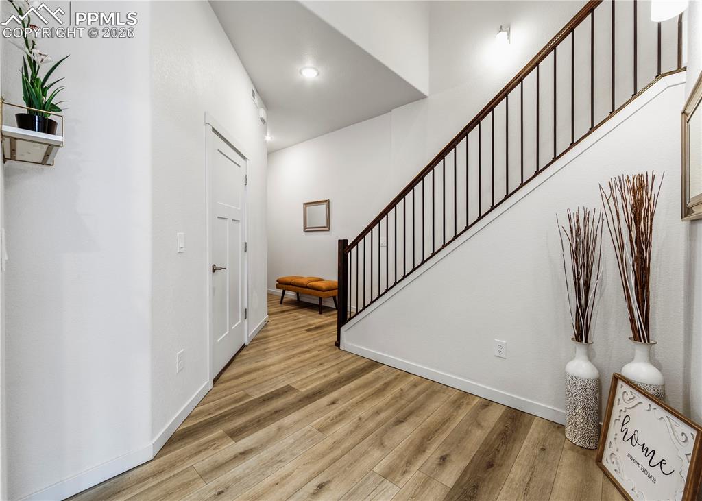 Image 5 of 46: Foyer featuring stairway and light wood-style floors